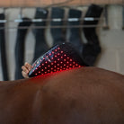 EquiSol horse leg wrap red light therapy in use on back.